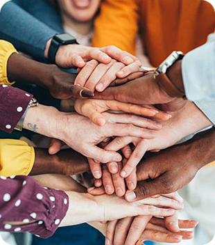 Diverse group of hands joined together, symbolising community support and connection, reflecting Ability to Achieve's commitment to inclusion and empowerment in The Entrance and Central Coast.