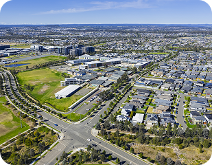 Aerial view of suburban area in South Sydney, showcasing residential neighborhoods, green spaces, and local infrastructure, relevant to Ability to Achieve's service areas.