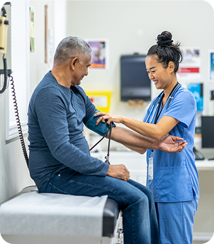 Healthcare professional measuring blood pressure of a patient in a clinical setting, reflecting Ability to Achieve's commitment to compassionate care and support services in Canberra.